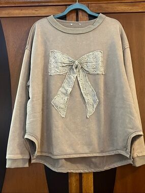 Easel (no tag) Eyelet Bow-Accent Oversized Pullover Top w/Side Notches - Taupe